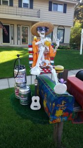 Yes, he's just kicking back with food, beer, music, and lots of sun. What more can he ask for?