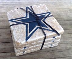 Each are made of some stone with the Dallas Cowboy star on them. And they're all tied in a ribbon when not in use.