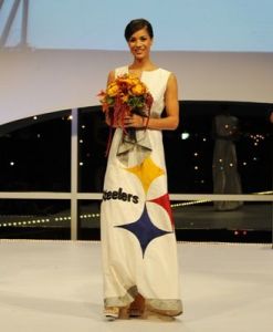 For one, the dress looks more like it was made from some Steeler bedsheet than anything. It's more like a long sun dress you'd wear at a family reunion. Not something for a wedding.