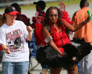 Wonder what this woman is doing here. Probably some dance or having a good time. Hope she doesn't get those feathers everywhere.