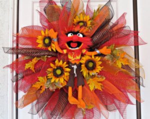 Well, the Animal in the center of this deco mesh wreath is plush. But he certainly seems happy.