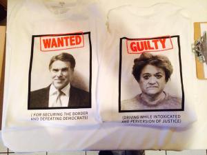 This shirt was made when he was under indictment for abusing his gubernatorial office. The person on the back is a DA who was prosecuting him.