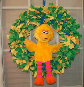 This one has a plush Big Bird in the center surrounded by rags of green, yellow, orange, an blue. Yet, he seems rather welcoming as always.