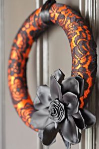 Said to be made from a pool noodle and a black lace stocking. Love the flower.