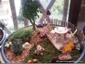 Well, not really since he's posing as a garden gnome. But I do love the deck is set up as well as the plants.