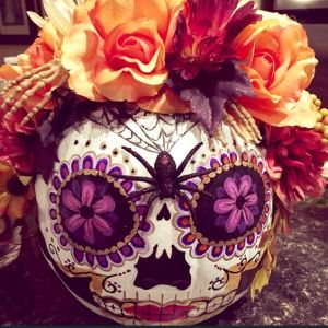 Yes, I'm aware some Halloween traditions get intermeshed with Dia de los Muertos. But this is a very nice rendition. The spider, skeleton hand, and flowers is spot on.