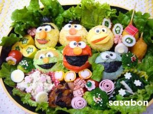 This one includes rice balls of Bert, Ernie, Big Bird, Oscar, Elmo, and Cookie Monster. And they're surrounded by salad.