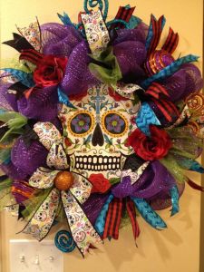 Has a colorful skull in the middle. And yes, the colors seem festive for a time of remembrance. But this is a Mexican holiday.