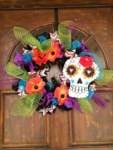 This one has so many decorations going for it. Love the skull with heart eyes and veil.