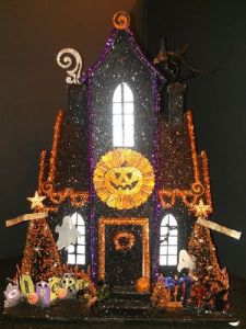 Now this one looks a bit similar to one of the other houses I just showed. Yet, it seems to be a Christmas cottage turned into a Halloween one. Not to mention, it seems more lively.