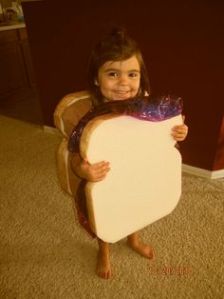 An easy costume with two slices of bread covered in different color plastic wrap. So cute.