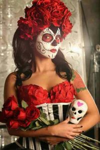 She certainly has her outfit match her face and hair. Love the flowers.