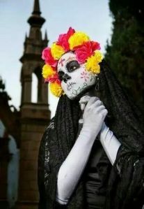 Well, I said they dress up to mock death and the old Mexican elite. Love the flowery black veil.