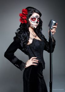 This one has a black dress with a rose in her hair. The mic is just a vintage touch akin to Walk the Line.