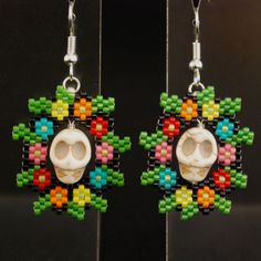 The flowers are beaded. The skulls aren't. But I don't think they go with the pendant I showed earlier.