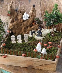 Well, this is a graveyard with a path and an imposing rock. But I'm not sure what the pumpkins are doing here.