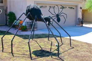 Before setting it up, explain to the neighbors that it's not a real spider and won't hurt anyone. Though they might be scared of it anyway.