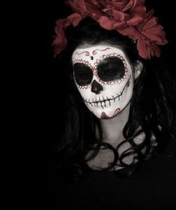 This one has black skull eyes and roses in her hair. But you can see her almost blend into the background.