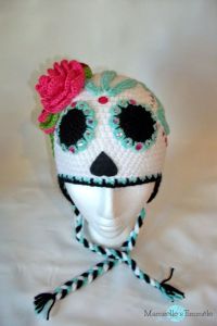 This one has a rose and eyes lined with blue. Not as fancy as the other one but still just as lovely.