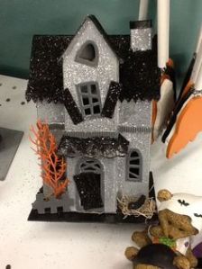 Well, the top windows, anyway. The shutters seem about to fall off as well. Also, the orange tree is rather freaky.