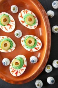 Because on Halloween, deviled eggs should be bloodshot eyeballs. It's only fitting.