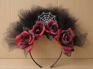 This is another headband for a costume with roses, a spiderweb, and black tulle. Still, I think it's stunning.