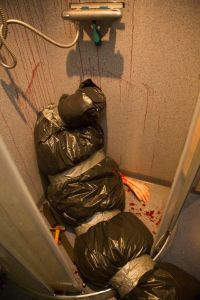 Yes, that's supposed to be a dead body in a trash bag. No, it's not real or else someone would be in trouble by this point. Please don't let it be real.