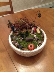 As you might notice, the mini garden decorations aren't always up to scale. Look on how the skeleton seems to be a giant compared to where the graves are and the other figures.