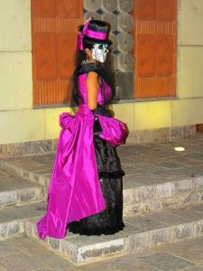 She's even dressed in traditional Victorian attire, too. Love the purple on this.