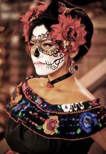 Well, her eyes are laced with gold petals. Yet, she has red flowers in her hair and an embroidered dress.