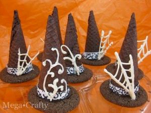 I've shown witch hats before but not with cobwebs on them. Wonder if they're candy, icing, chocolate, or inedible decoration.