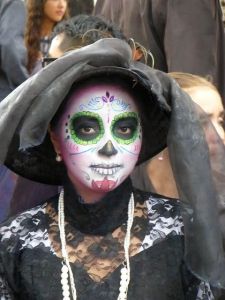 Well, it's not a large hat but it's a fancy one nonetheless. Goes nice with her black lace dress.