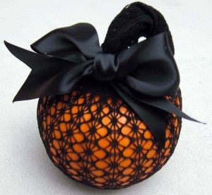 Might want to go with a craft pumpkin if you want it to last. But I really like the black ribbon and lace on this.