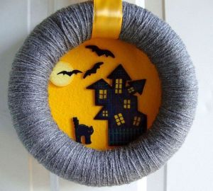 The wreath is from yarn and the scene from felt. Not too scary, but fine for families with kids.