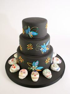 Like you see on this cake, which wouldn't be for Dia de los Muertos without them. Still, love the flowers.