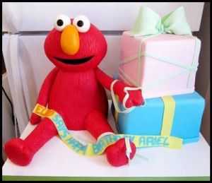 Even has Elmo near the presents. Certainly a birthday cake for a little kid. So cute.
