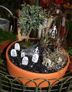 This one has cobwebs and a skeleton in a cage. Not sure why. Though I like the tree.