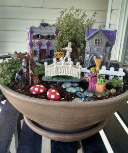 This seems to have a little Halloween village going on. There's even a witch and a Grim Reaper there, too.