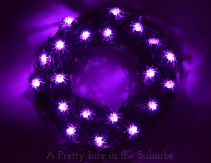 And yet another wreath to scare the bejesus out of arachnaphobes. Doesn't hurt if the spiders are lighted up purple, too.