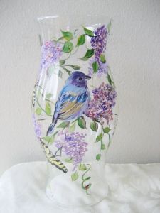 Love how it sits among the purple flowers. So pretty to behold. So well painted.