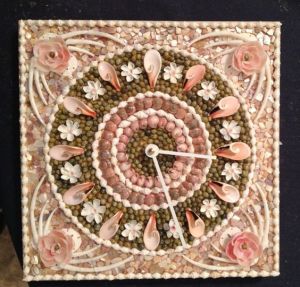 Yes, it's another seashell clock. But this one is pink and in mosaic form.