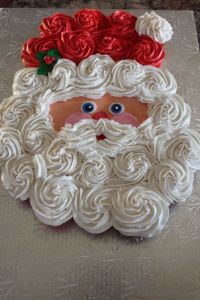 Well, this one seems to have a nice Santa beard. Also like the holly on his hat.
