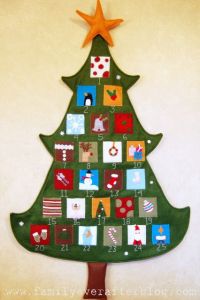 Behind each felt door on this Christmas tree is a little surprise. What it is, I can't say.
