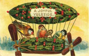 Yet, as to why they're flying in a holly wreath, I have absolutely no idea. I mean.birds fly while holly leaves have thorns on them.