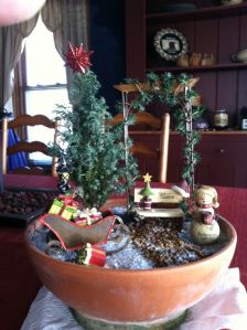 The tree on this one only has a red star. But you have to like the snowman and the sleigh full of gifts.