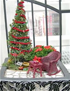 Helps if the bush has red bows, too. Not to mention, the gifts near the tree bring an extra holiday touch.