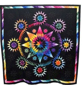 Another quilt in a rainbow color scheme. But this one is in a star configuration.