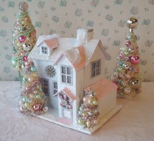 This one uses a couple pendants on the front to bring out the winter sparkle. Love the one near the roof the best.