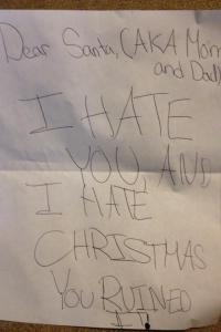 Guess this kid saw Mommy kissing Santa Claus last Christmas. Seems to be a little Grinch in the making.