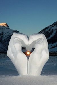 This one uses two giant hands made out of snow. But it's guaranteed to warm your heart.